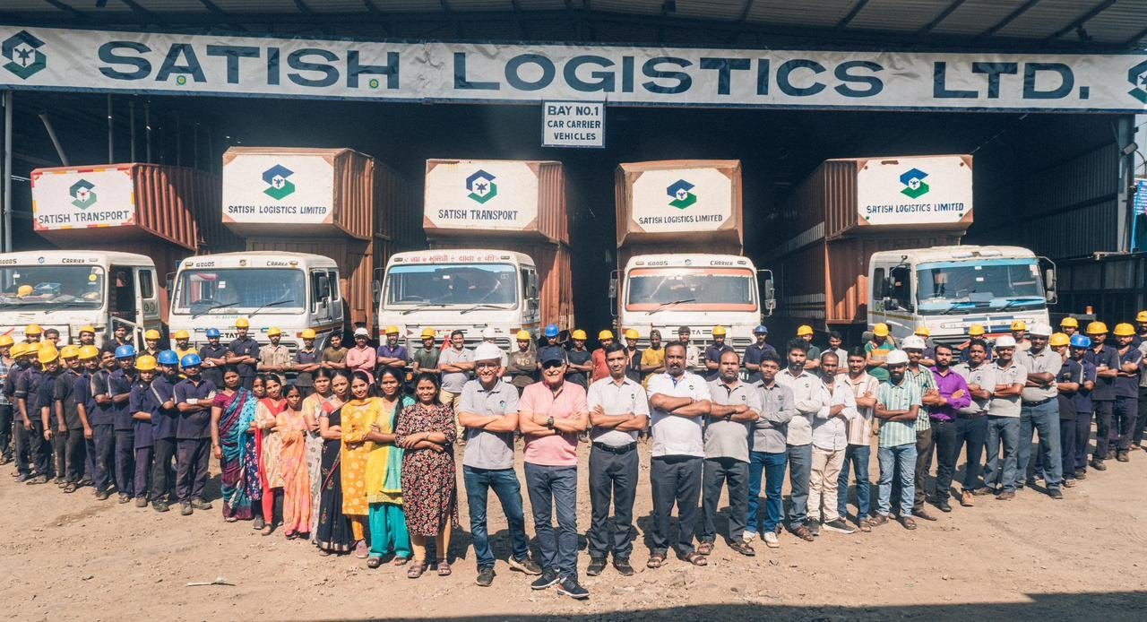 The Satish Logistics team in front of the car carrier bays at Somatne Phata
